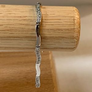 Silver tone tennis bracelet with safety catch 7 1/4 inches